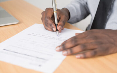 Man signing a contract
