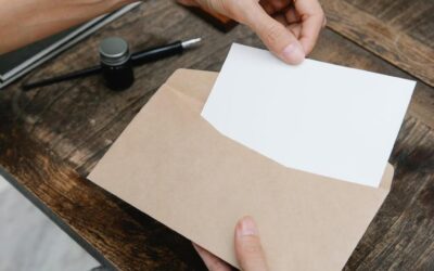Person taking a letter out of an envelope