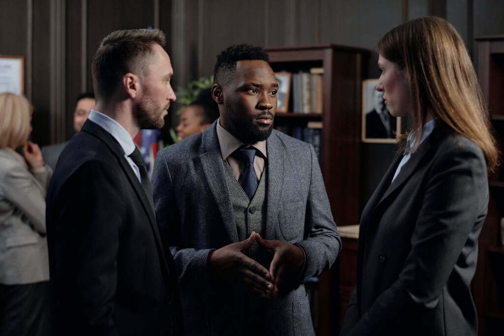 Three solicitors talking to each other