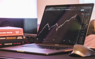 Laptop with graph of stock market growth