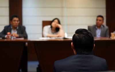 Person appearing before three judges