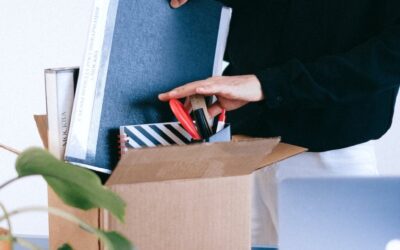 Woman packing away the belongings from her desk