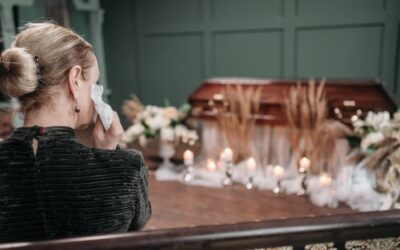 Widow dressed in black at funeral