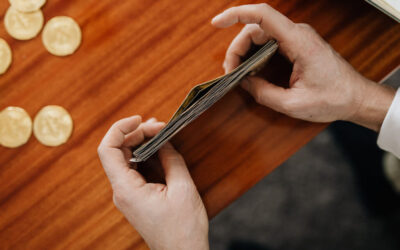 Person stacking pound notes
