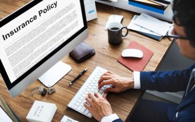 Man on a computer looking at an insurance policy