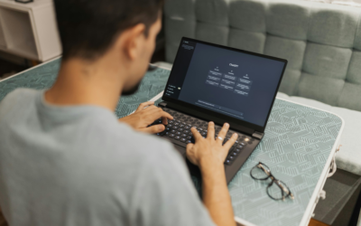 A man working on a laptop with AI Tool ChatGPT on his screen for work
