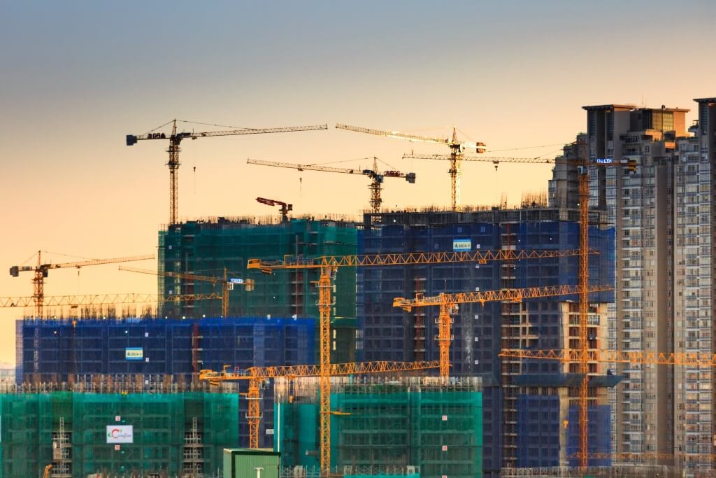 Construction site with multiple cranes - NEC early warning notice